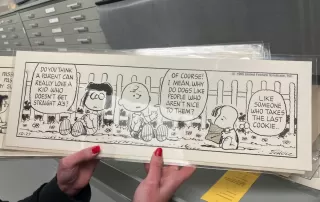 Peanuts cartoon with Lucy, Charlie Brown and Snoopy